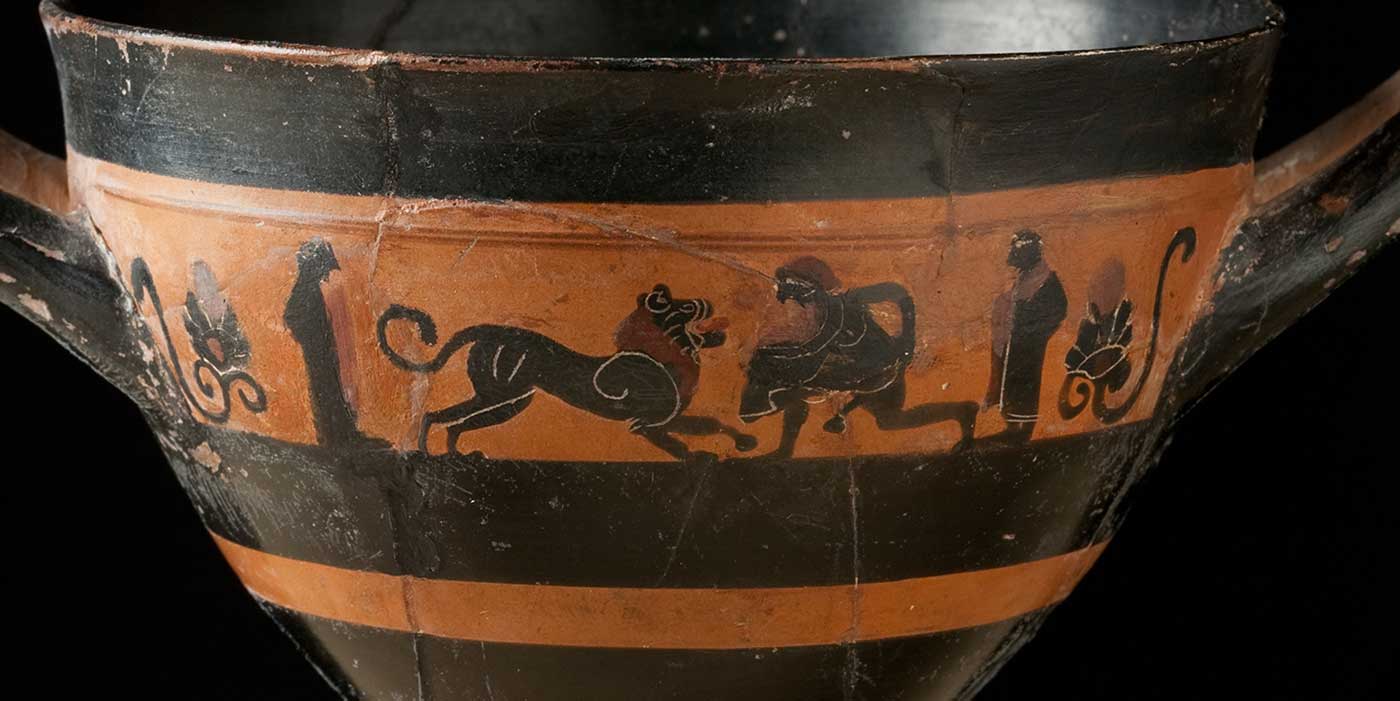 Ancient pottery with paintings of humans and animals