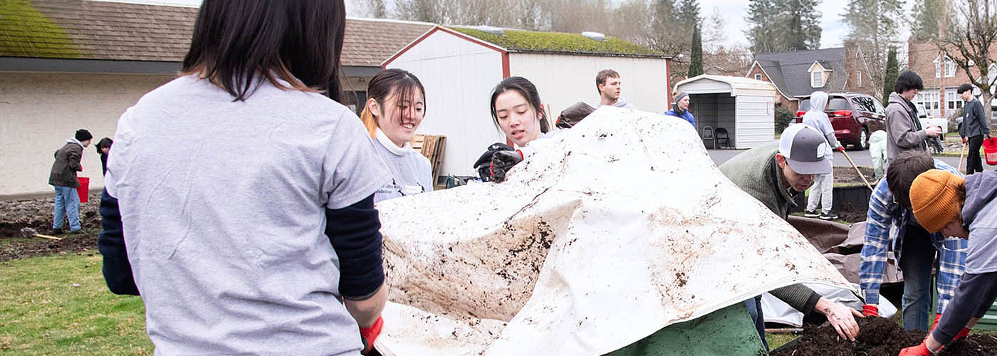 Willamette students helping with a community event.