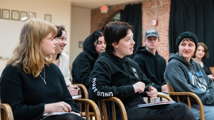 A group of people in a classroom.