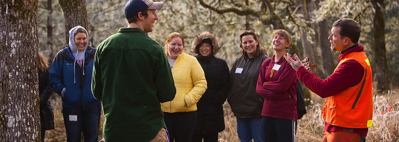 A group of students and a professor at Willamette's Zena property.