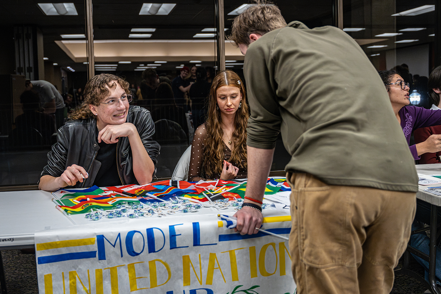 Students at a United Nations booth during a campus clubs expo