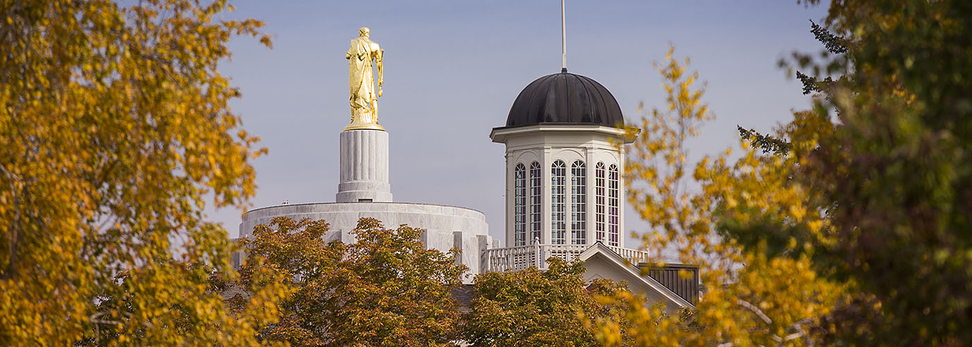 Willamette's Waller Hall and the Oregon State Capitol Building in autumn.