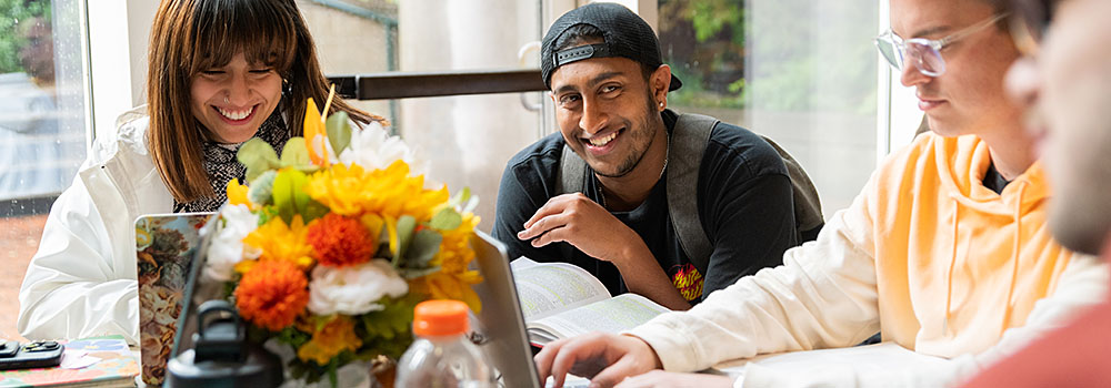 A group of Law students sitting at a table together.