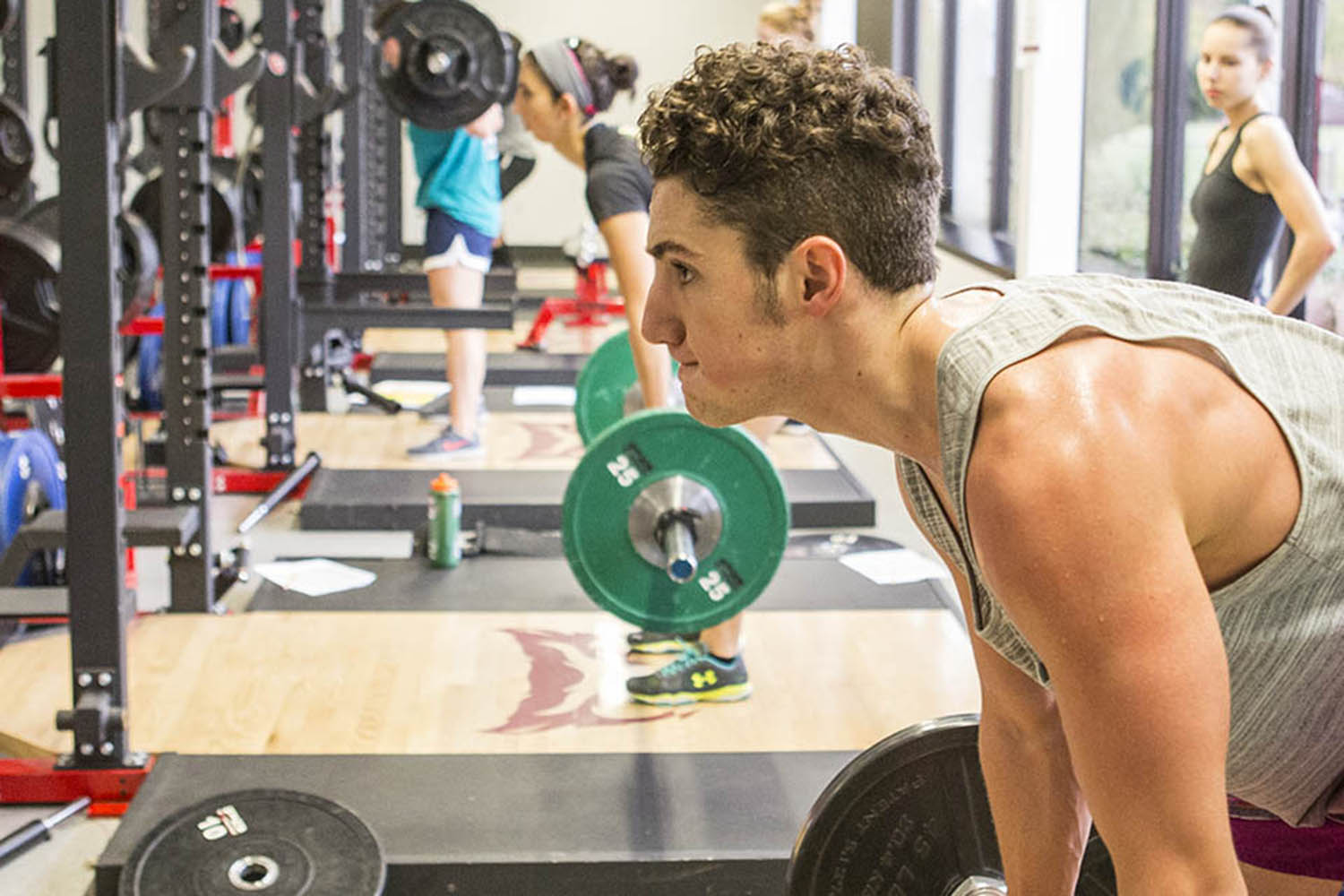 One athlete lifting weights at the Sparks Athletic and Recreation Complex
