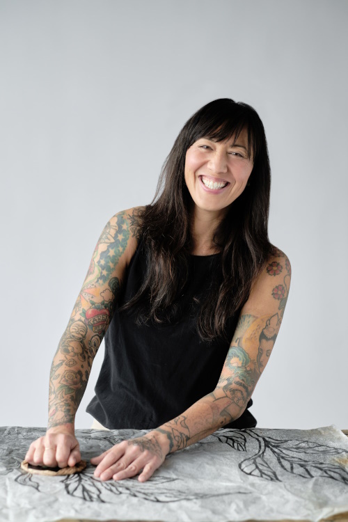 Photo of Kanani Miyamoto working on an art piece