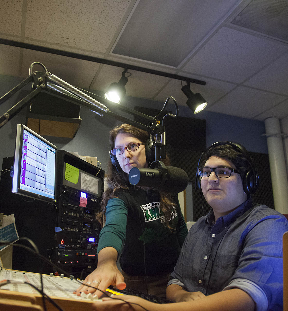 A Willamette student and professor work together in a sound studio at Willamette's Salem campus.
