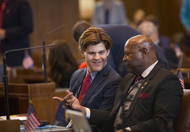 Two people having a conversation in a courtroom