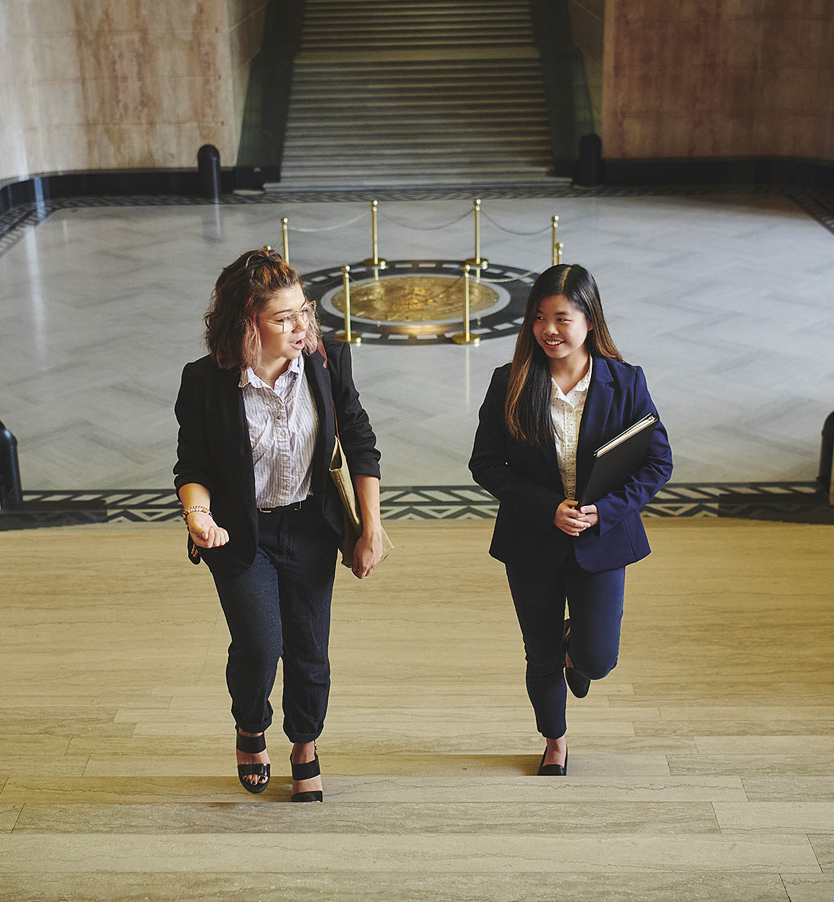 Willamette student and professor walking in the Oregon state capitol 