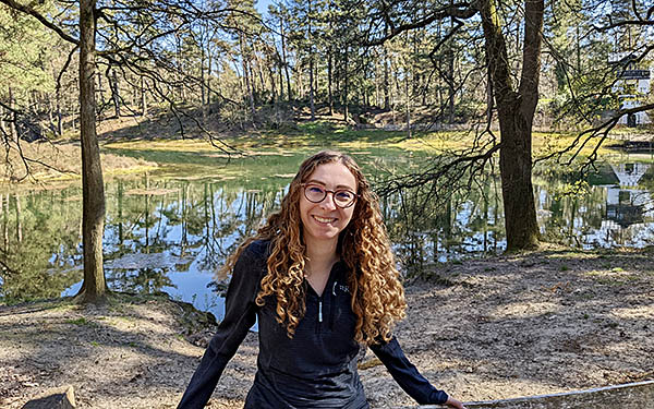 Photo of Elena Familetto infront of a pond 