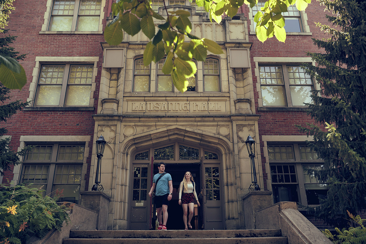 Two students walking outside Lausanne Hall