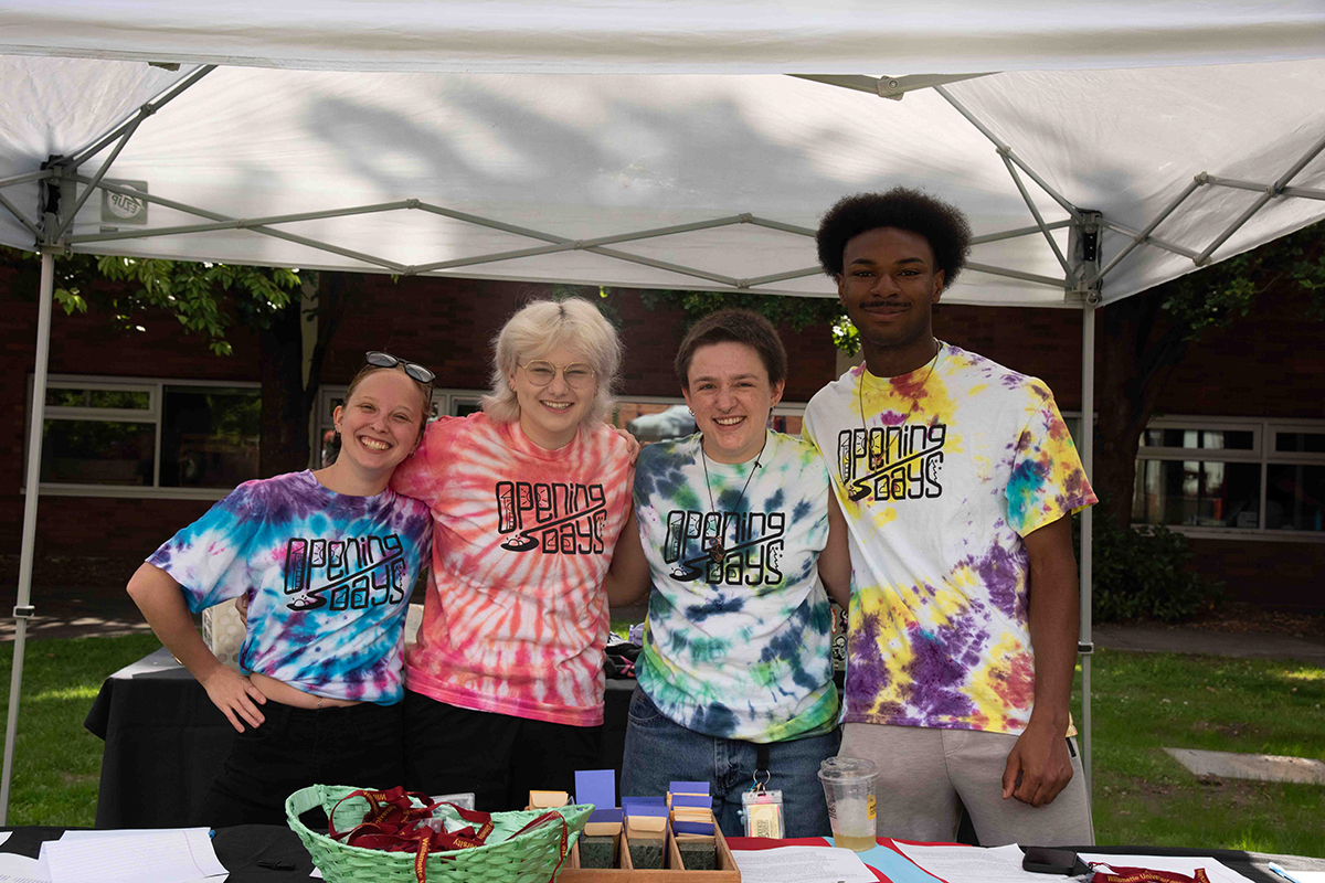 four RAs welcoming students on move in day