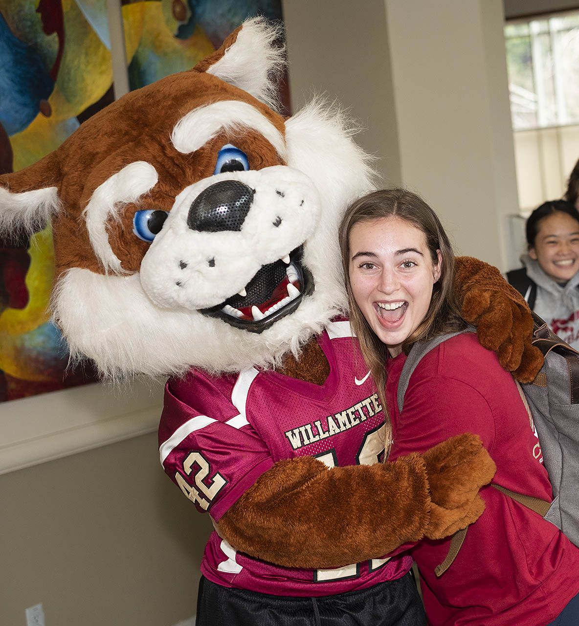 A student hugging Blitz