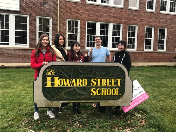 Several students standing outside of Howard Street Charter School