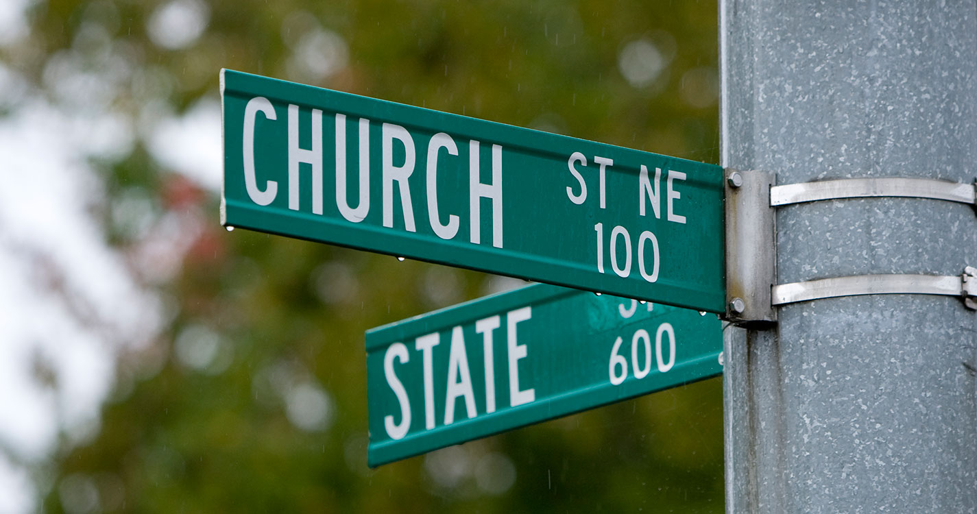 Corner street signs saying Church and State