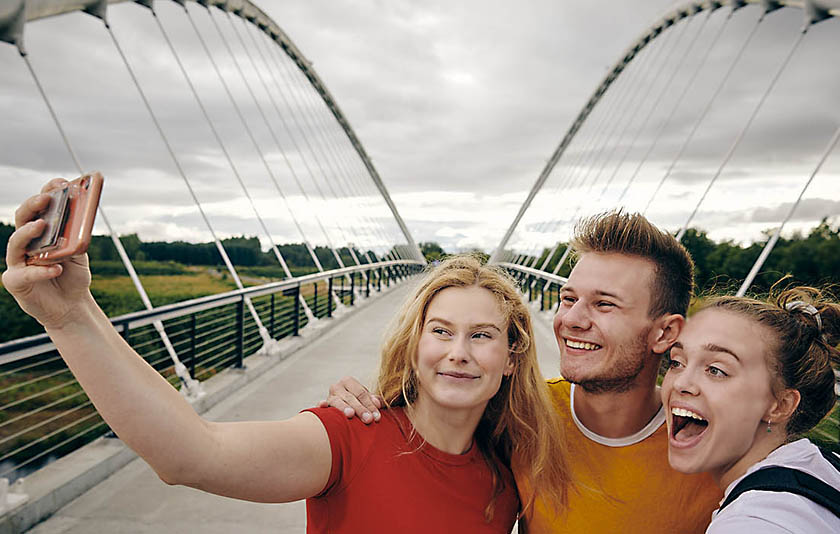 Three students taking a selfie at Salem's Riverfront Park