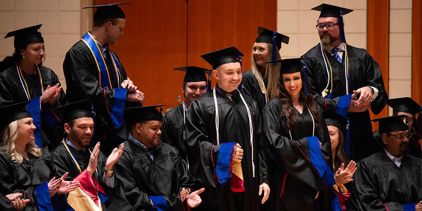 A group of recent graduates at Willamette
