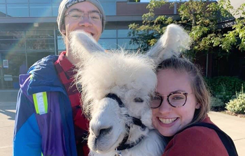 two students and a llama