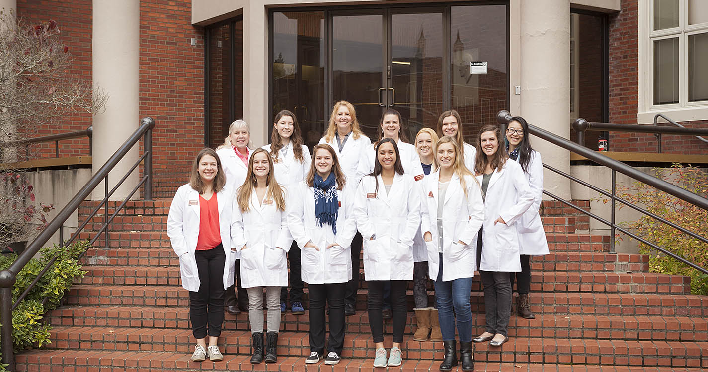 Group photo of the Willamette Webber Scholars standing at the entrance of Collin Science Center